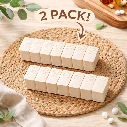 Two beige pill organizers with '2 Pack!' text on a woven mat.