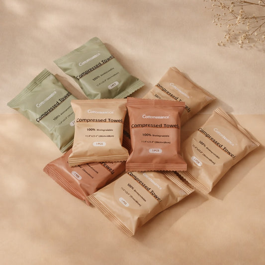 Compressed towels in various packaging on a beige background