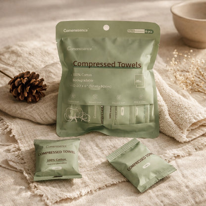 Compressed towels packaging with towels on a textured surface