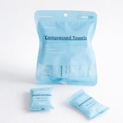 Packaged compressed towels on a white background